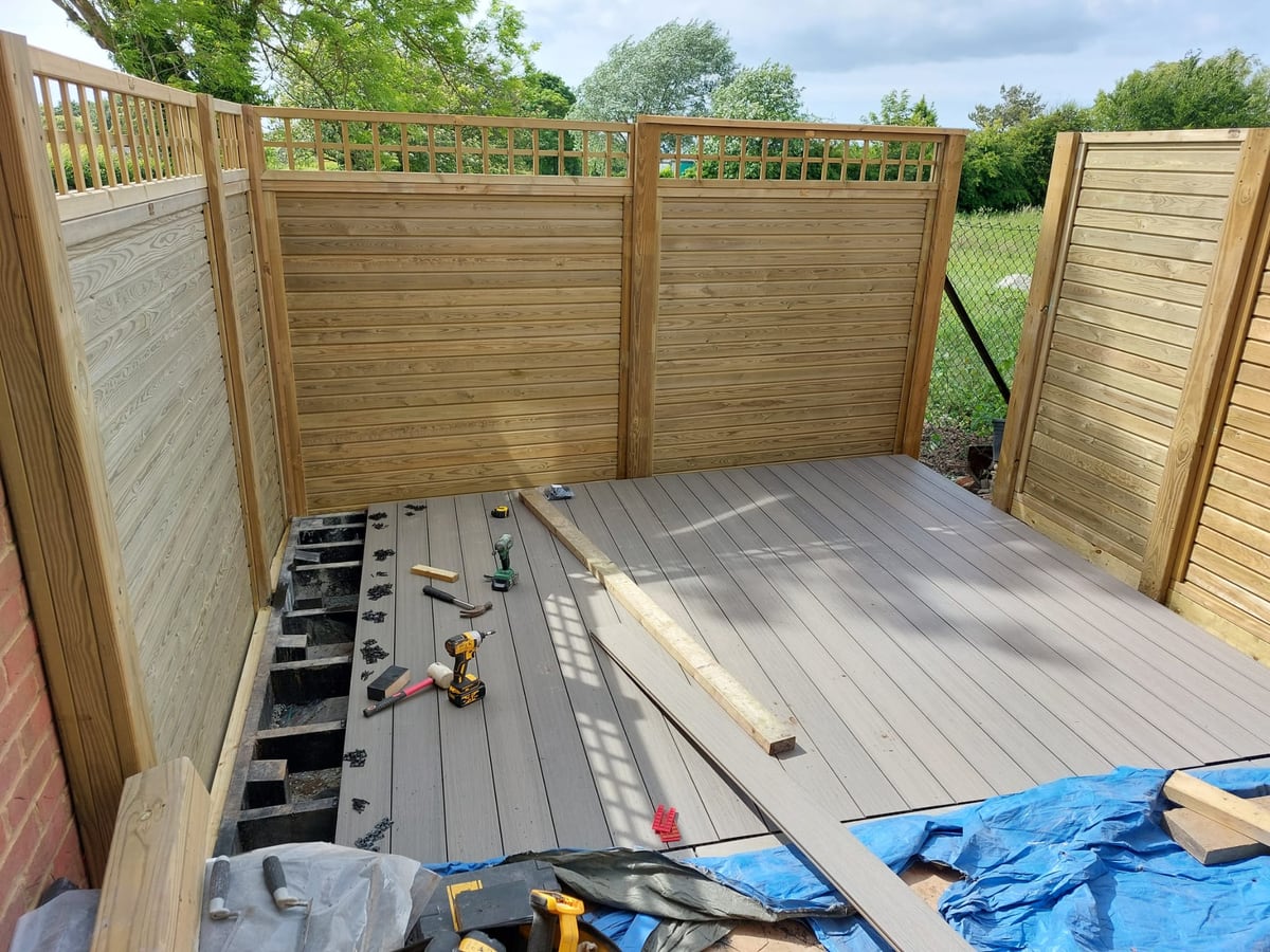 Timber screen fencing and decking during installation
