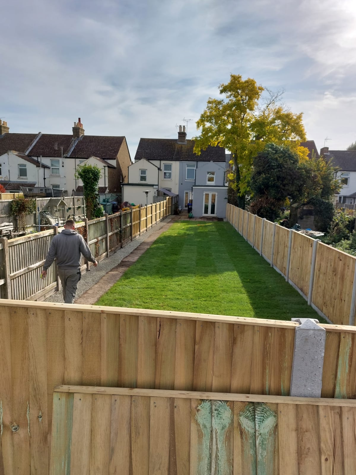 Long back garden with newly installed timber boundary fencing