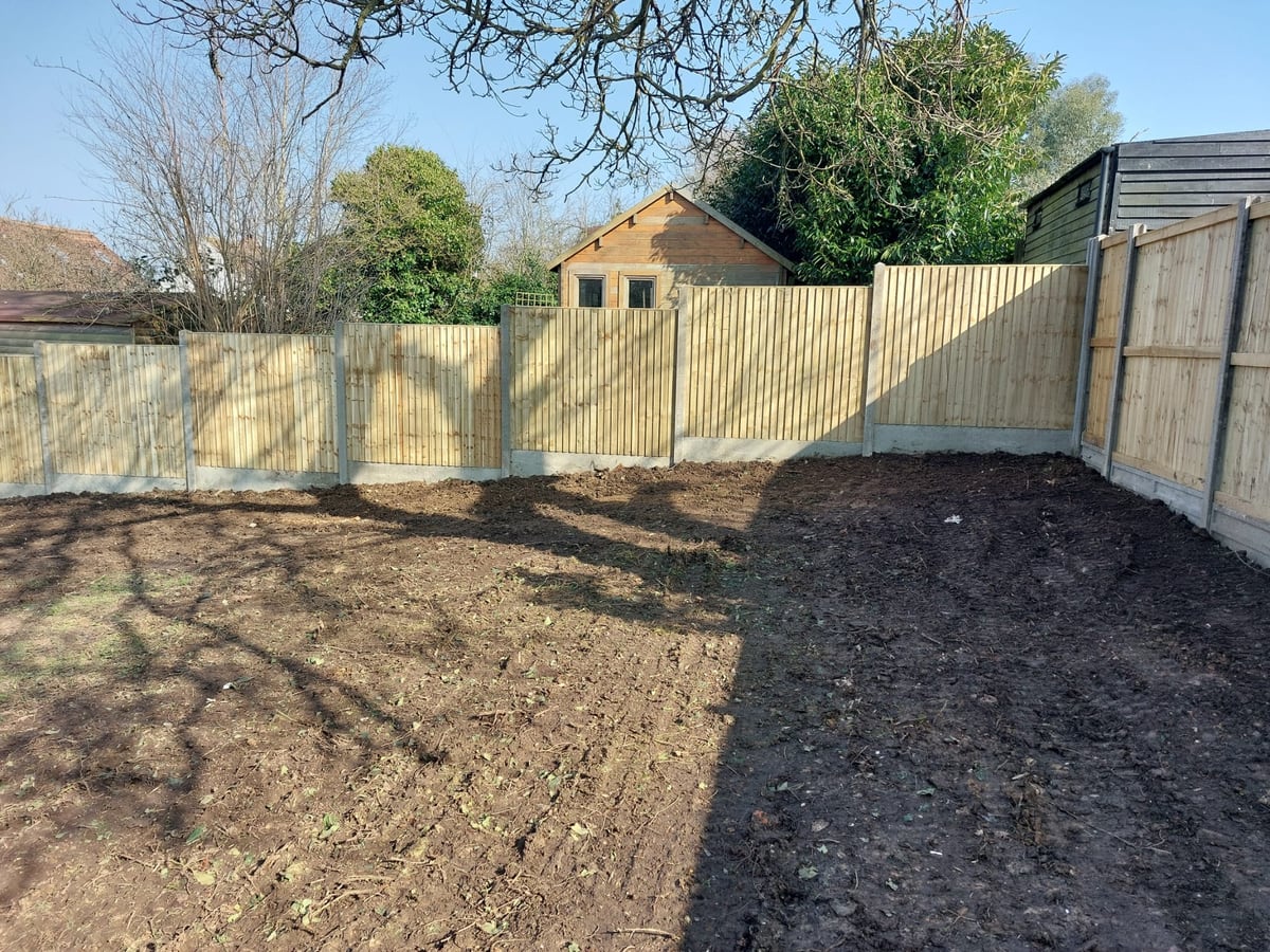 Finished timber fencing around a cleared garden area